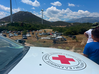 Fly G Aviation medevac helicopter on standby near a special stage of the Acropolis Rally Greece, providing rapid emergency medical response for competitors, officials and spectators.