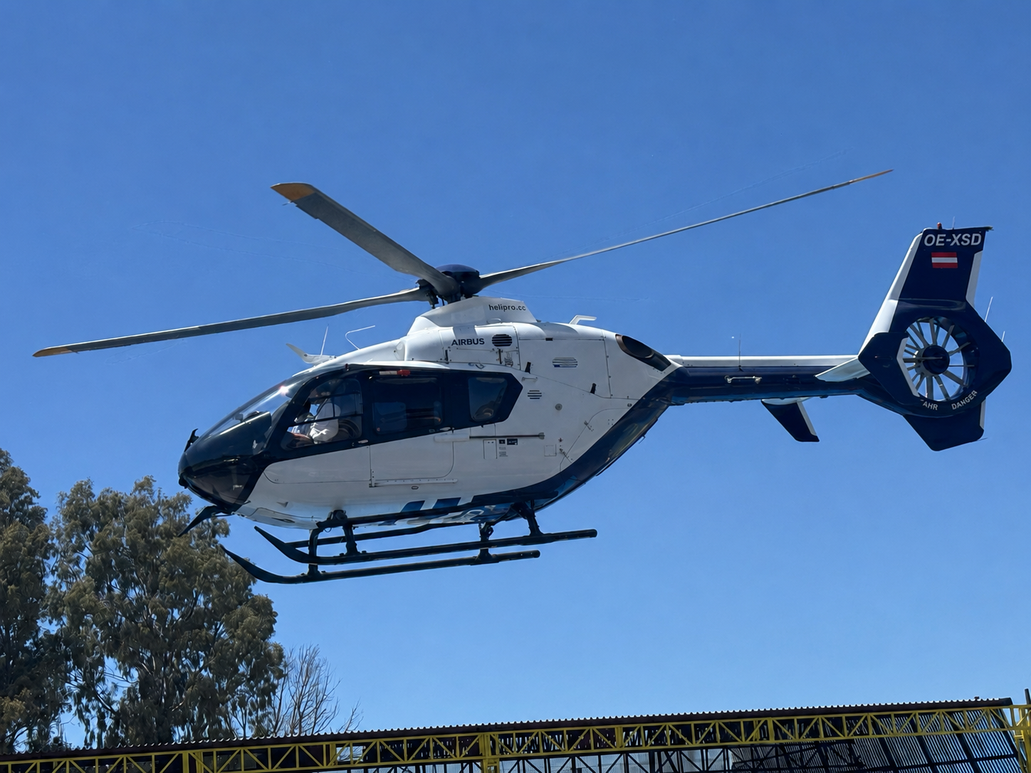 Airbus H135 helicopter departing from the Fly G Aviation Athens helipad for Mykonos